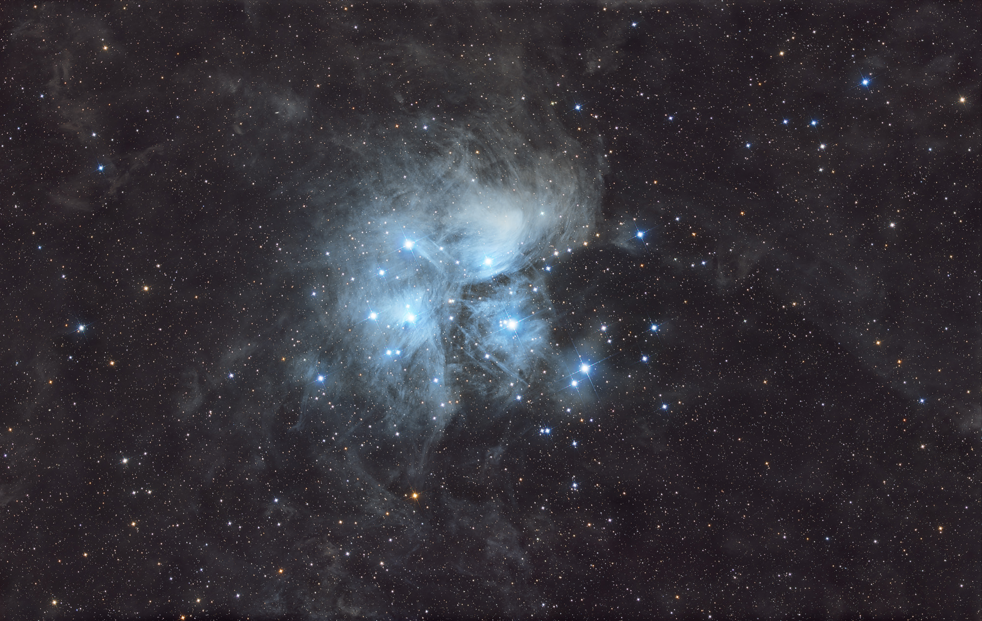 The Pleiades, Messier 45 is an open star cluster containing middle-aged, hot B-type stars in the north-west of the constellation Taurus.